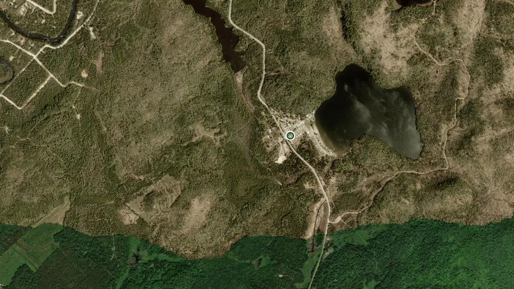 Aerial view of Domaine du Lac Caché, Hébergement et Éco-Camping and surroundings