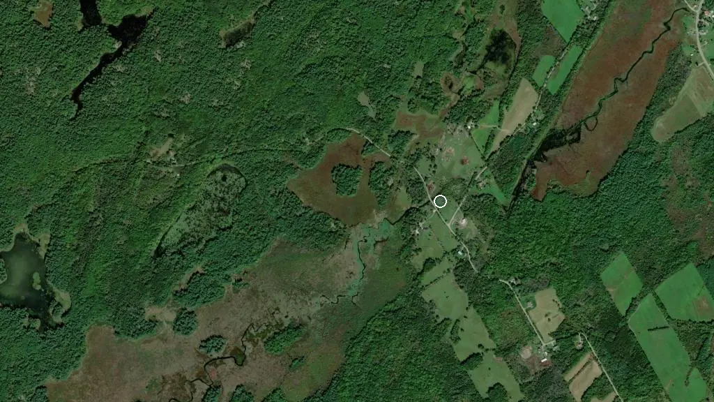 Aerial view of Happy Green Acres and surroundings