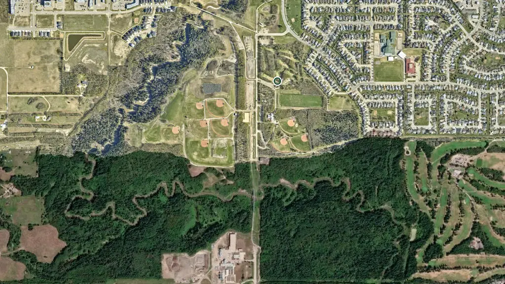 Aerial view of Bear Paw Par 3 Golf & RV Park and surroundings